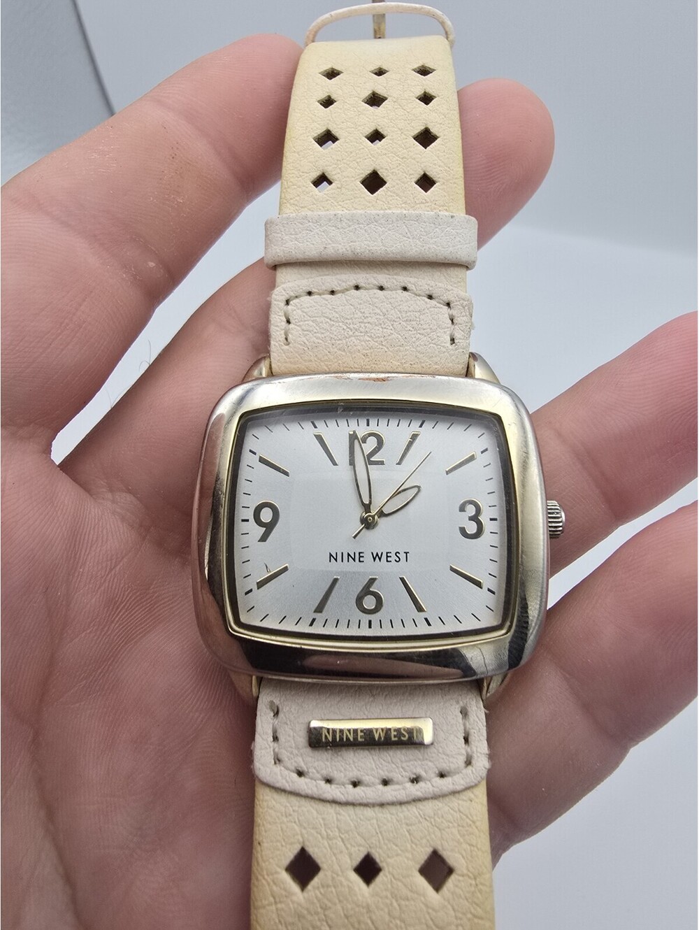Nine West NW/1080 Gold Tone Tonneau Cream Perforated Leather Analog Quartz Watch